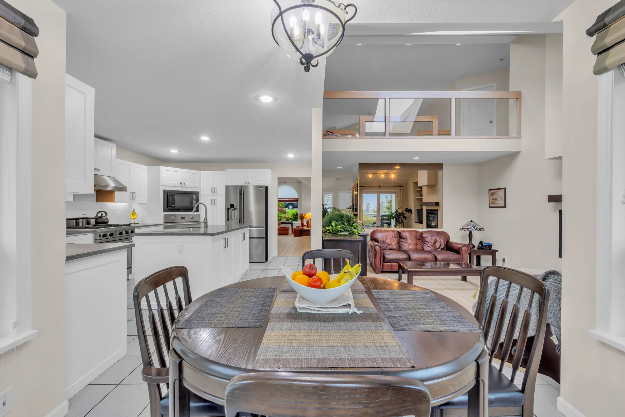 From the nook across the kitchen to the family room, the upper hall railing above